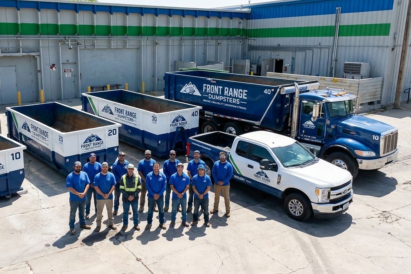 The Front Range Dumpsters crew standing in front of their roll-off containers and trucks